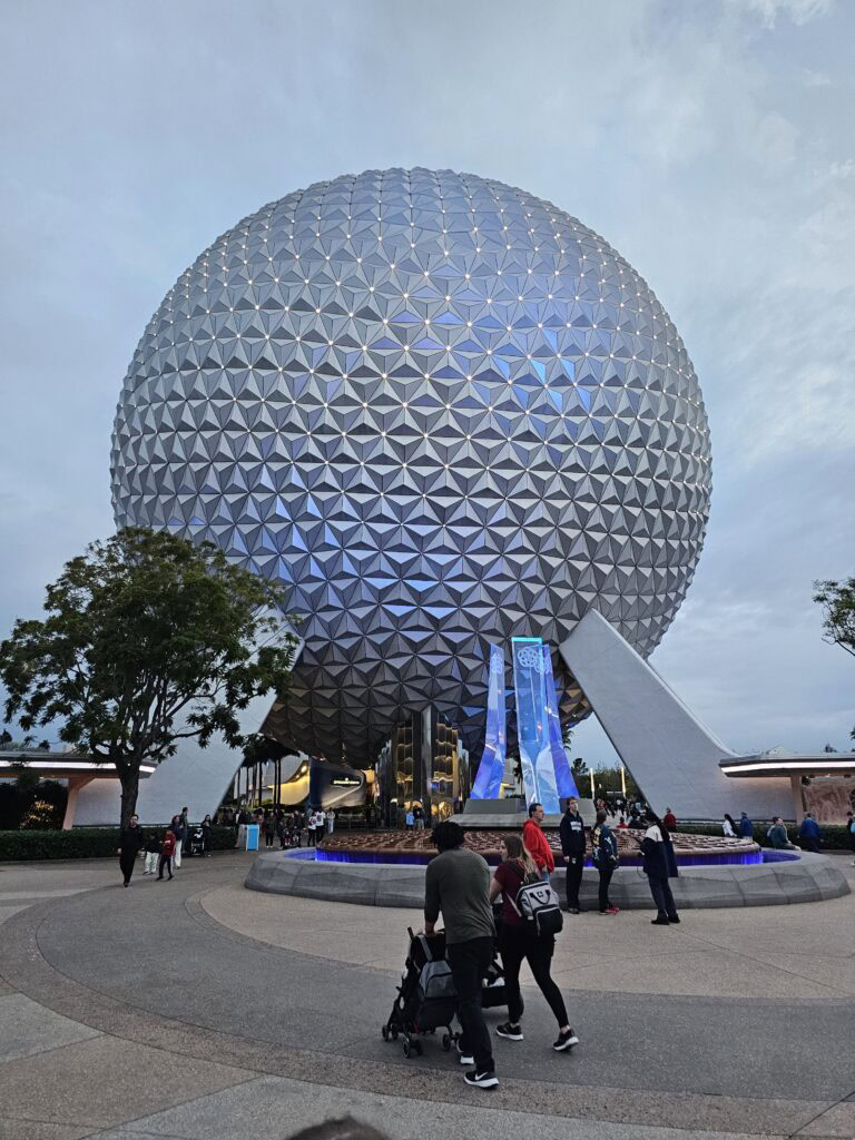 Epcot with toddlers and babies in front of ball
