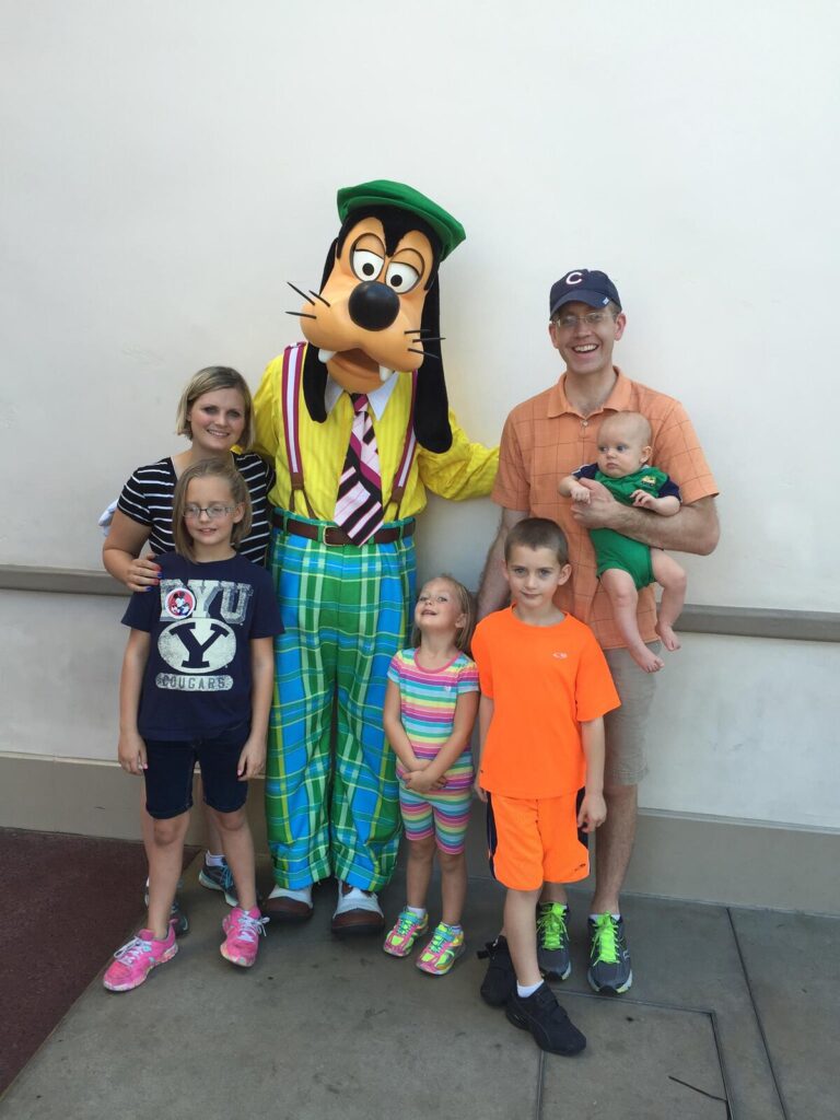 Family at Disney with a Baby with Goofy