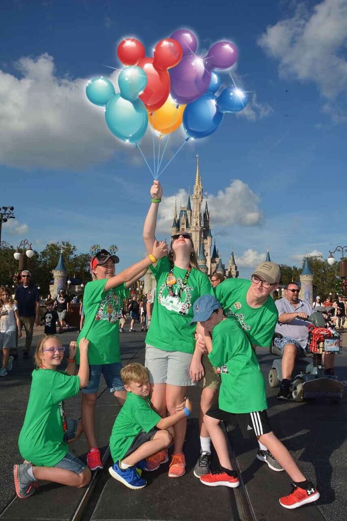 Disney Photo Pass Image with family in front of Castle